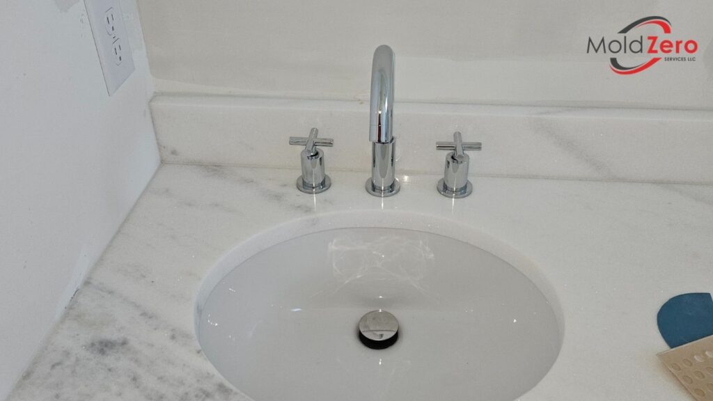 a marble sink in a bathroom with a faucet