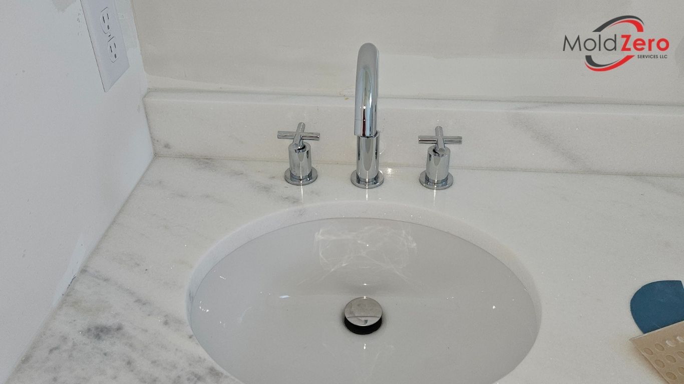 a marble sink in a bathroom with a faucet